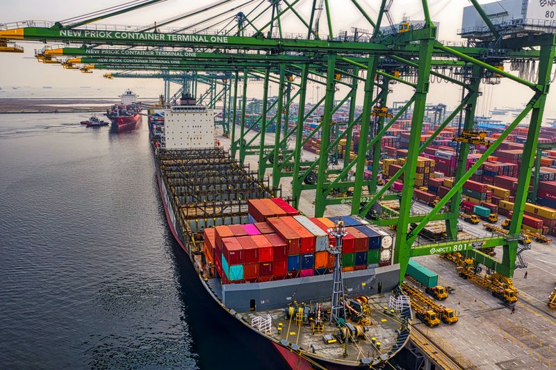 Container terminal cranes loading a cargo ship
